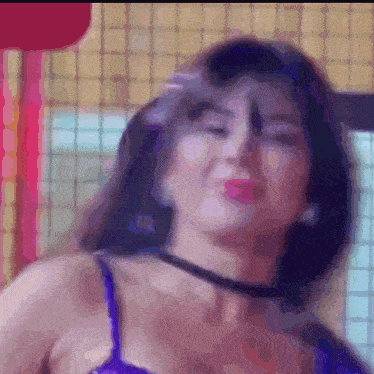 a blurry picture of a woman wearing a blue top