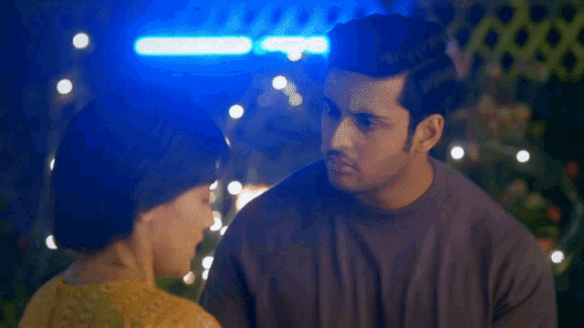 a man and a woman are looking at each other with the words tumhe chot lagi below them
