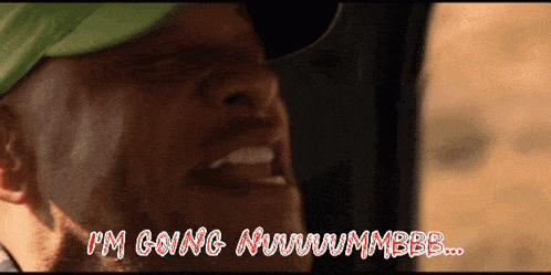a man wearing a green hat says i 'm going nwwwmmbbb