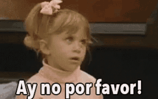 a little girl is making a funny face and saying `` ay no por favor ! ''
