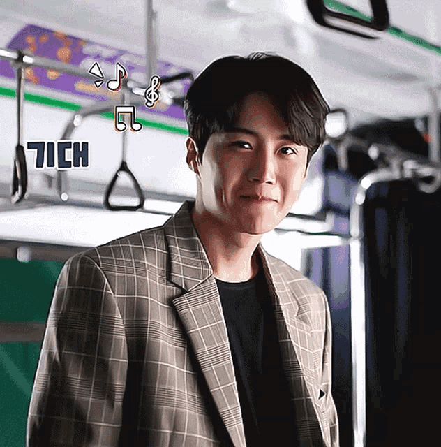 a man in a plaid jacket is smiling in front of a sign that says ' 7ich '