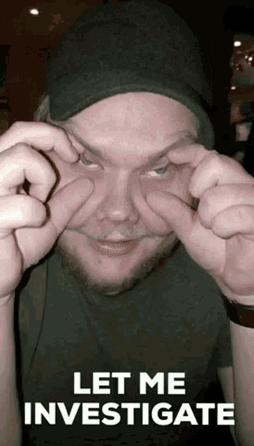 a man is making a funny face with his hands and the words let me investigate on the bottom