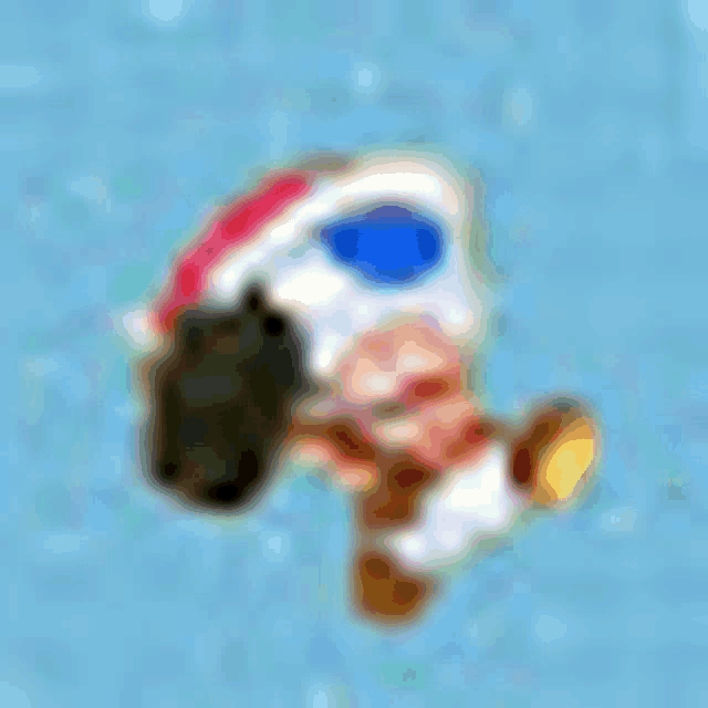 a blurred image of a cartoon character wearing a helmet and goggles .