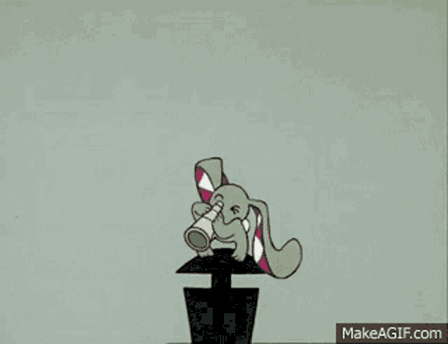a cartoon rabbit is standing on top of a black object .
