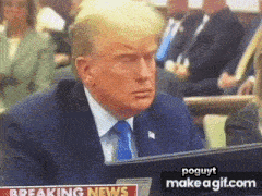 a man in a suit and tie is sitting in front of a computer screen with the words breaking news on it
