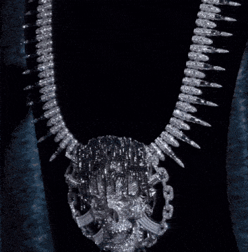 a close up of a skull with a chain around it