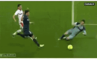a soccer ball is going through a goal with canal + on the bottom right