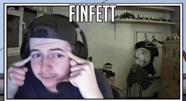 a young man wearing headphones with the name finfett written above him