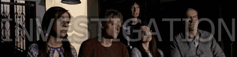 a group of people are sitting in a dark room and the word investigation is behind them