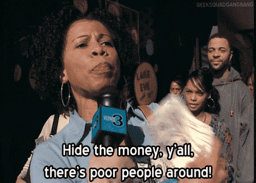 a woman is holding a microphone and says hide the money y'all there 's poor people around