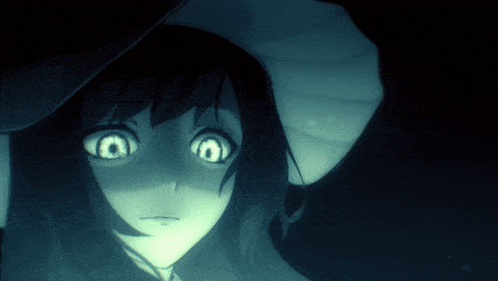a close up of a girl 's face with a hat on