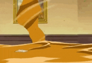 a person is standing in a room with a painting on the wall and a painting on the floor .