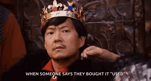 a man wearing a crown is sitting in a throne and says when someone says they bought it used .