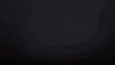 a reflection of a city skyline in the water at night