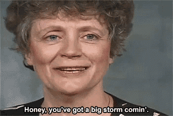 a woman is smiling and saying `` honey , you 've got a big storm comin '' .