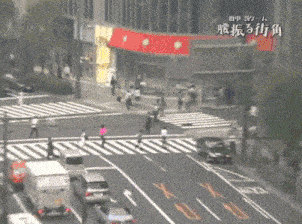 an aerial view of a crosswalk with chinese writing on the bottom left