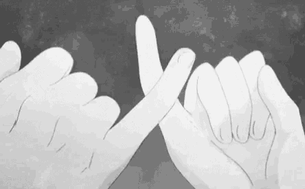 a couple of hands making a promise with their fingers .