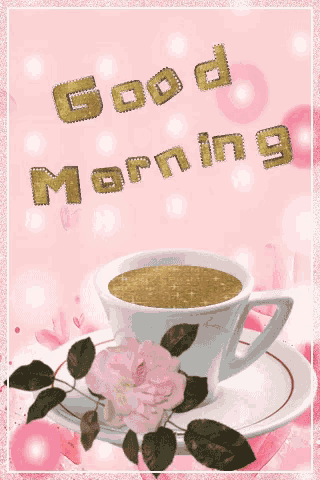 a cup of coffee sits on a saucer with the words good morning written on it
