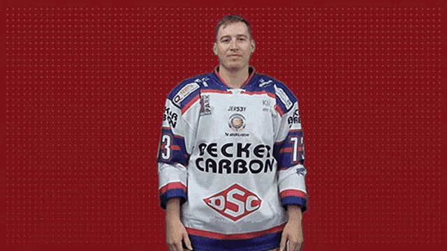a man in a becke carbon jersey is smiling