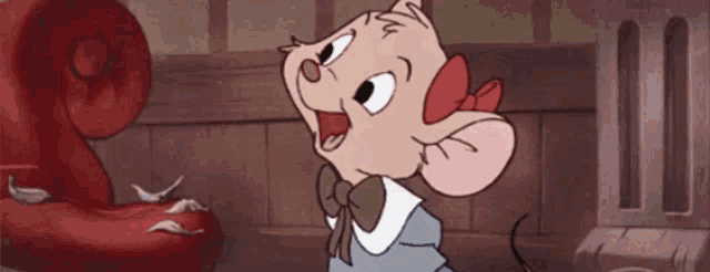 a cartoon mouse is wearing a bow tie and looking at something