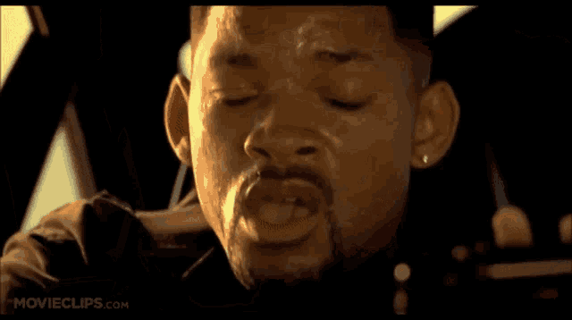 a close up of a man 's face with movieclips.com written on the bottom right
