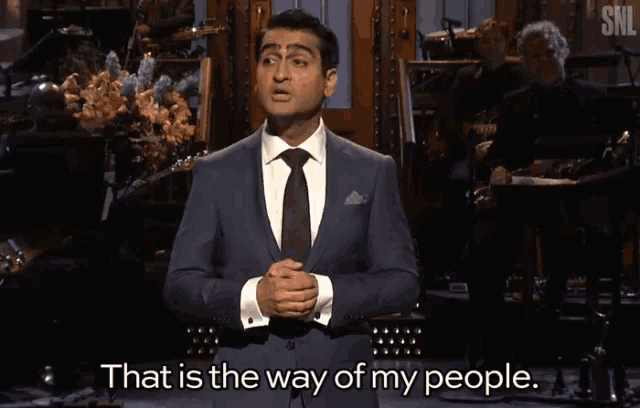 a man in a suit and tie is giving a speech and says that is the way of my people