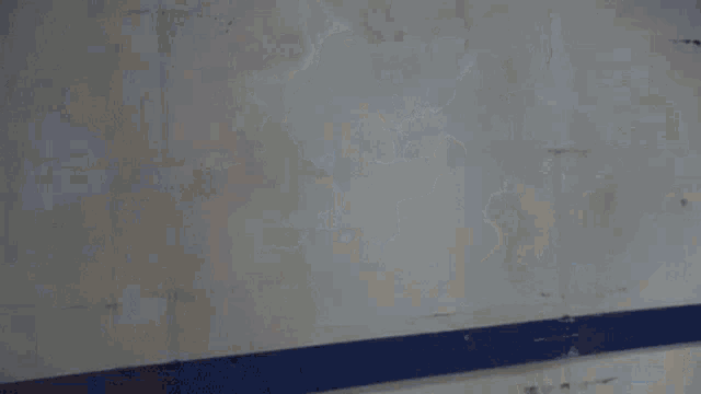 a person is standing in a room with smoke coming out of the ceiling .