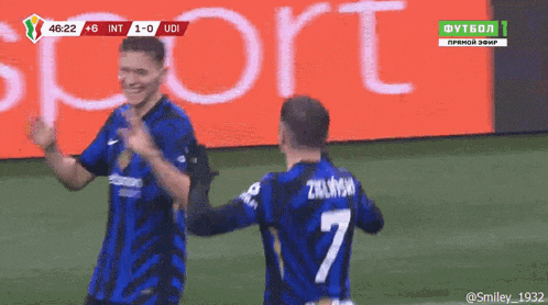 two soccer players on a field with the number 7 on the back