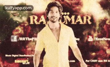 a man in a yellow shirt is standing in front of a poster for a movie called ram omar