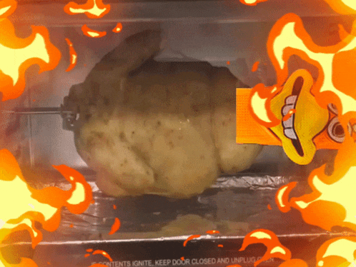 a roasted chicken in an oven with flames surrounding it