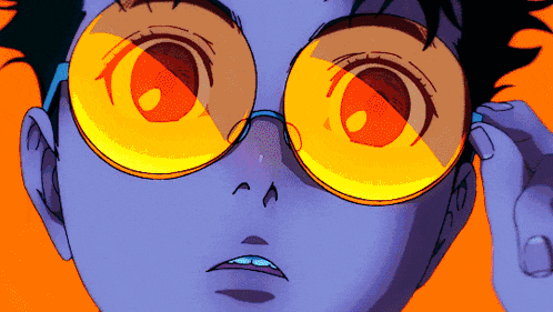 a close up of a person 's face wearing glasses