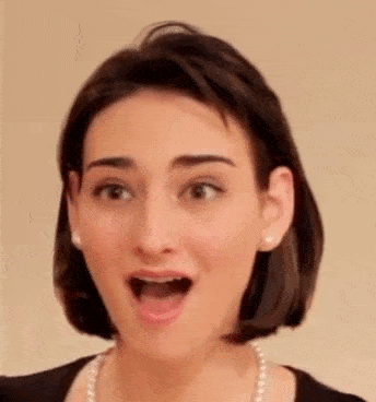 a woman is making a surprised face with her mouth open