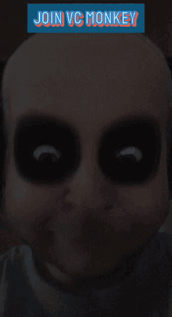 a picture of a baby with black eyes and the words join vc monkey above it