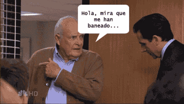 a man talking to another man with a speech bubble saying hola mira que me han baneado