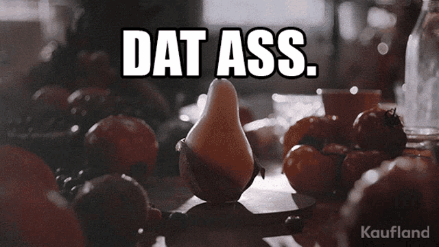 a pear sits on a cutting board with the words dat ass written above it