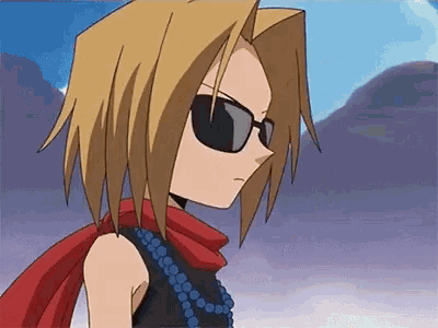 a close up of a cartoon character wearing sunglasses and a red scarf .