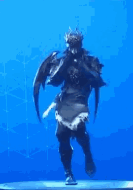 a knight with a crown on his head is dancing on a stage in front of a blue background .