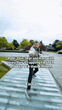 a man with grey hair is rapping faster than eminem and better than finna