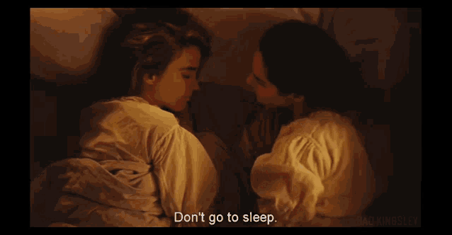 a couple laying in bed with the words do n't go to sleep