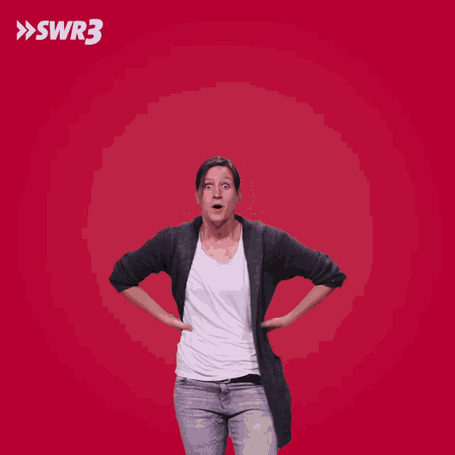 a woman with her arms outstretched in front of a red background with the letters swr3 on it