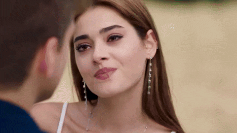 a man and a woman are looking into each other 's eyes .