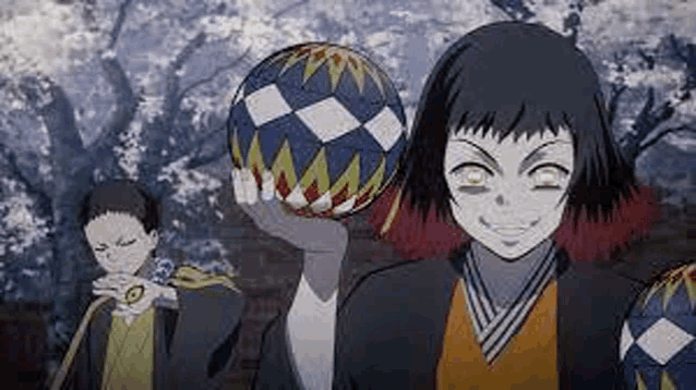 a girl is holding a ball in her hand while standing next to two men .