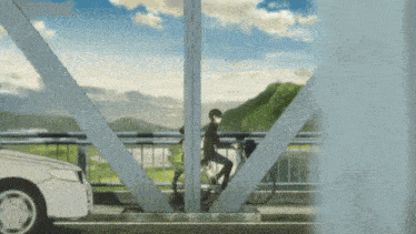 a man is riding a bike under a bridge with a car behind him