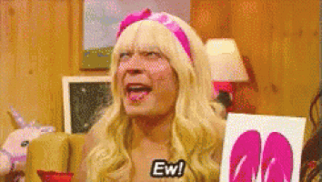 a man in a blonde wig and pink headband is saying ew
