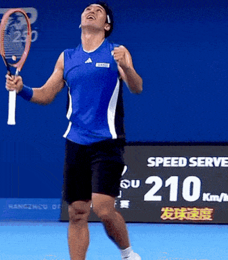 a man is holding a tennis racquet in front of a speed serve sign
