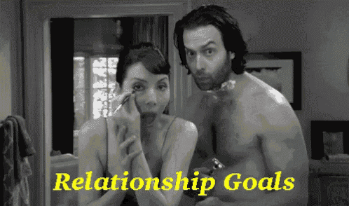 a black and white photo of a man and a woman with the words relationship goals in yellow