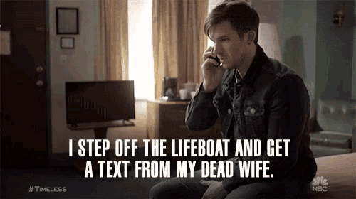 a man sits on a bed talking on a cell phone with the caption i step off the lifeboat and get a text