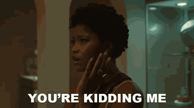 a woman talking on a cell phone with the words " you 're kidding me " behind her
