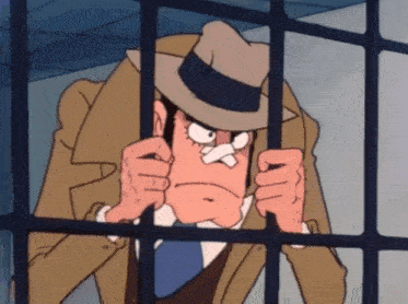 a man in a hat is behind bars and making a face