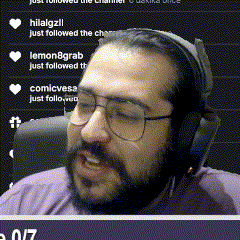 a man with glasses and headphones is sitting in front of a screen that says hilalgzll just followed the channel